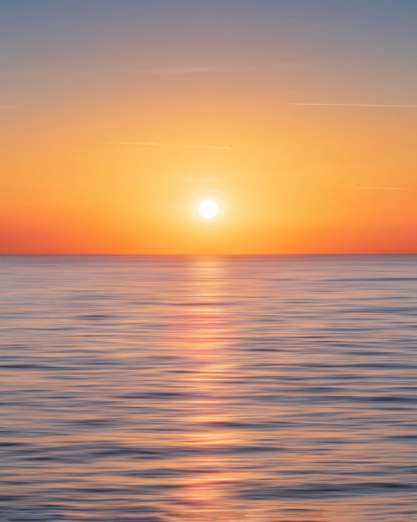 Serene ocean view during sunset in Kadıköy, Istanbul, showcasing a beautiful horizon and calm waters.